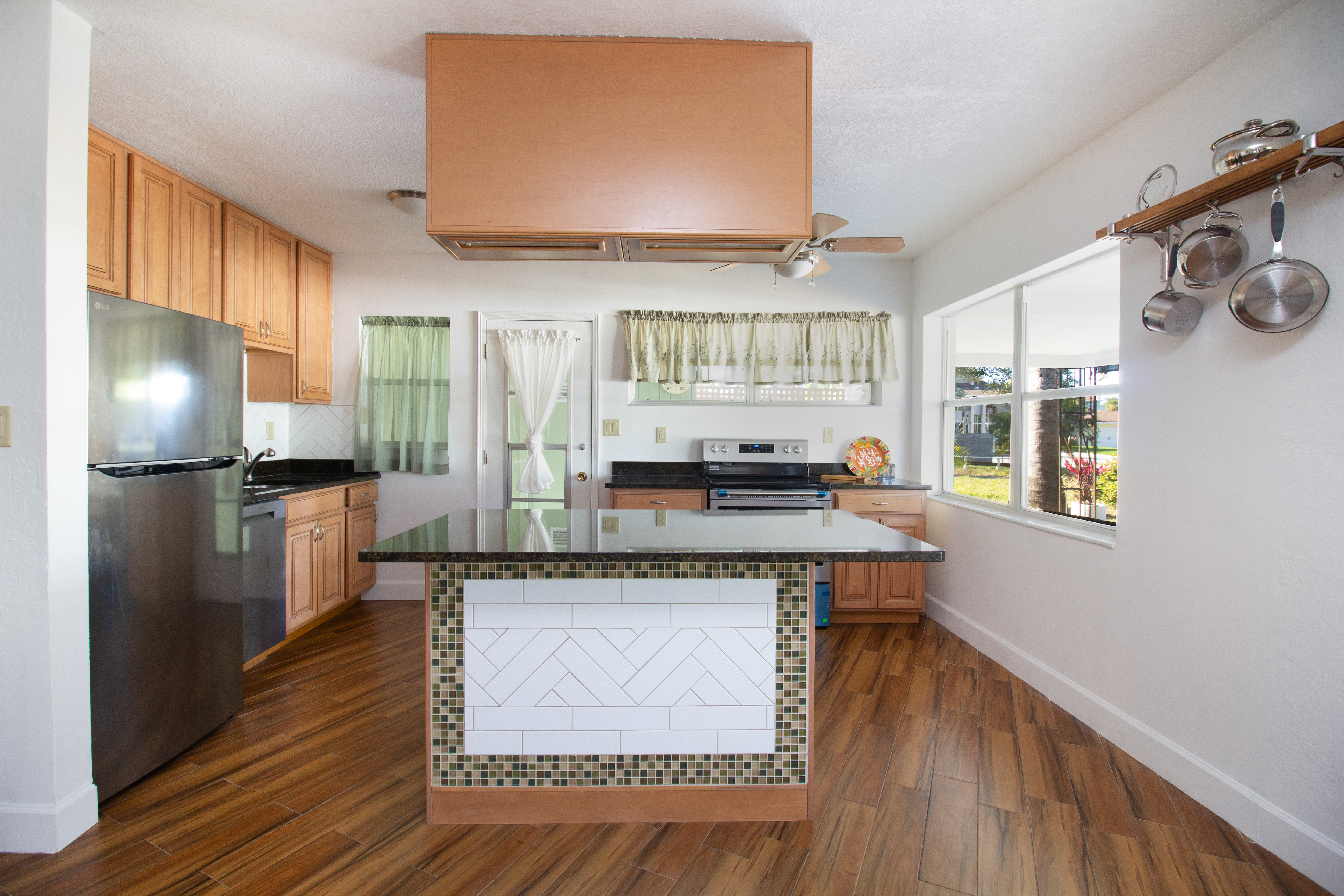 Kitchen island, stove, fridge and sink